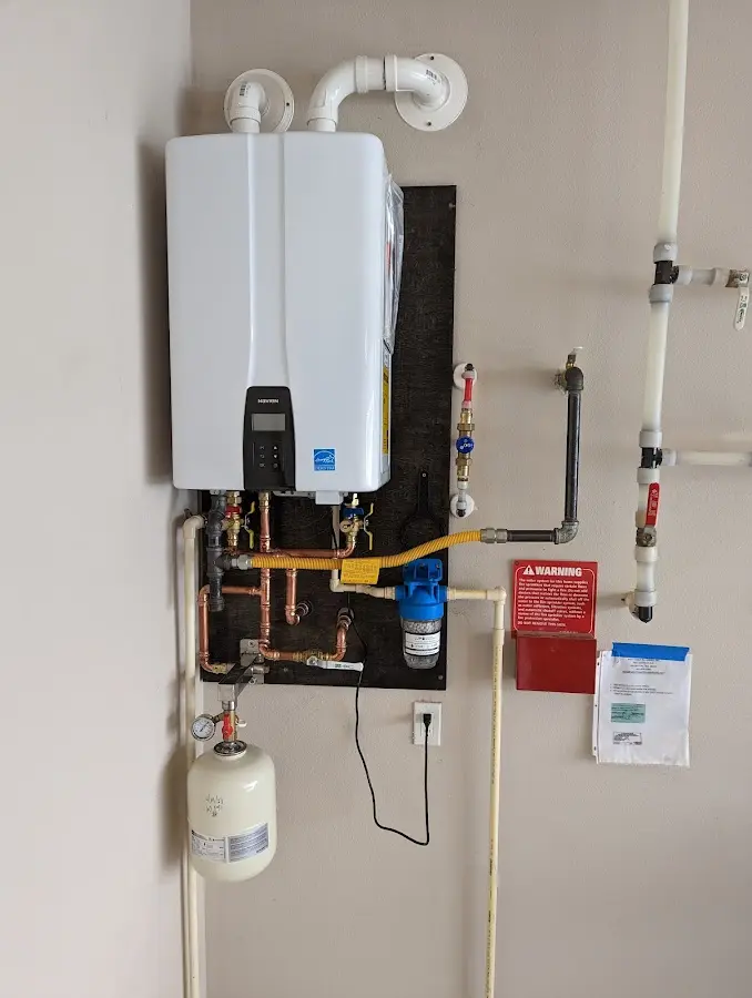 Professional plumber installing copper piping in a Ozark home